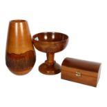 A turned yew wood comport, H21cm, a hardwood jewel box, and a turned and carved wood vase