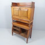 A Victorian walnut Aesthetic writing cabinet, the fitted fall front over single drawer with lower