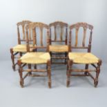 A set of four French rush seated farmhouse dining chairs.