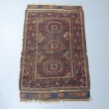 A red-ground Afghan rug. 150x95cm. Very worn all over, with visible patches. Faded. The pile has