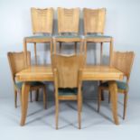 A 1930s French oak dining table, 138x74x90cm, and six matching chairs. This is a draw-leaf table but