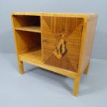 A Swedish modernist Art Deco cabinet in birch, with marquetry musician to door. 65x63x40cm