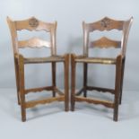 A pair of European or Russian Arts & Crafts chairs with chip carved top rails in the manner of