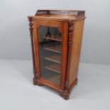 A Victorian mahogany music cabinet, with raised gallery, turned supports and single glazed