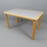 A Danish rectangular dining table with bent ply legs by Rud Thygesen and Johnny Sorensen for
