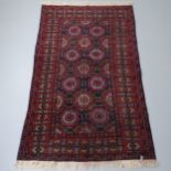 A red-ground Baluchi rug. 193x122cm. Good condition.