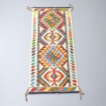 A Chobi Kilim runner. 147x66cm Good condition.