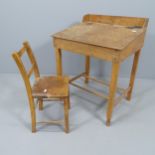 A vintage oak school desk, with label for Swallow Toys of London, 55x70x45cm, and a child's