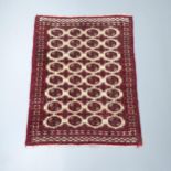 A red and white-ground Afghan rug. 145x117cm Overall good used condition, though there are some