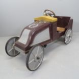A vintage painted metal child's pedal car. Length 110cm