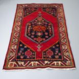 A red-ground Qashqai rug, 195x35cm Good condition.