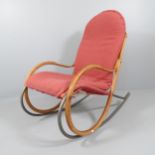 A mid-century Swiss Nonna rocking chair by Paul Tuttle for Strassle, having a steam bent laminated