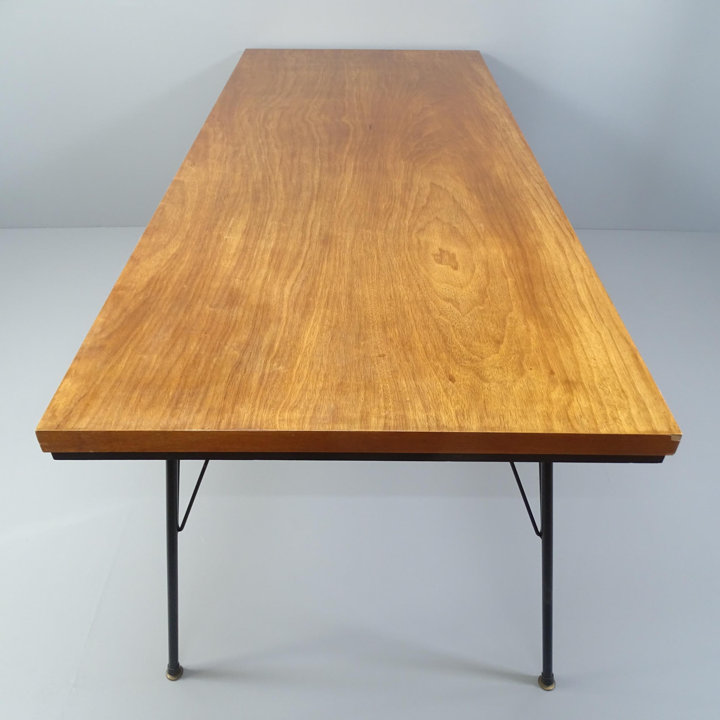 A mid-century teak dining table with ebonised frieze and iron rod legs. 198x71x84cm - Image 2 of 2