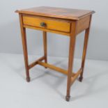 An Arts & Crafts walnut side table, with single frieze drawer and raised on square tapered legs with
