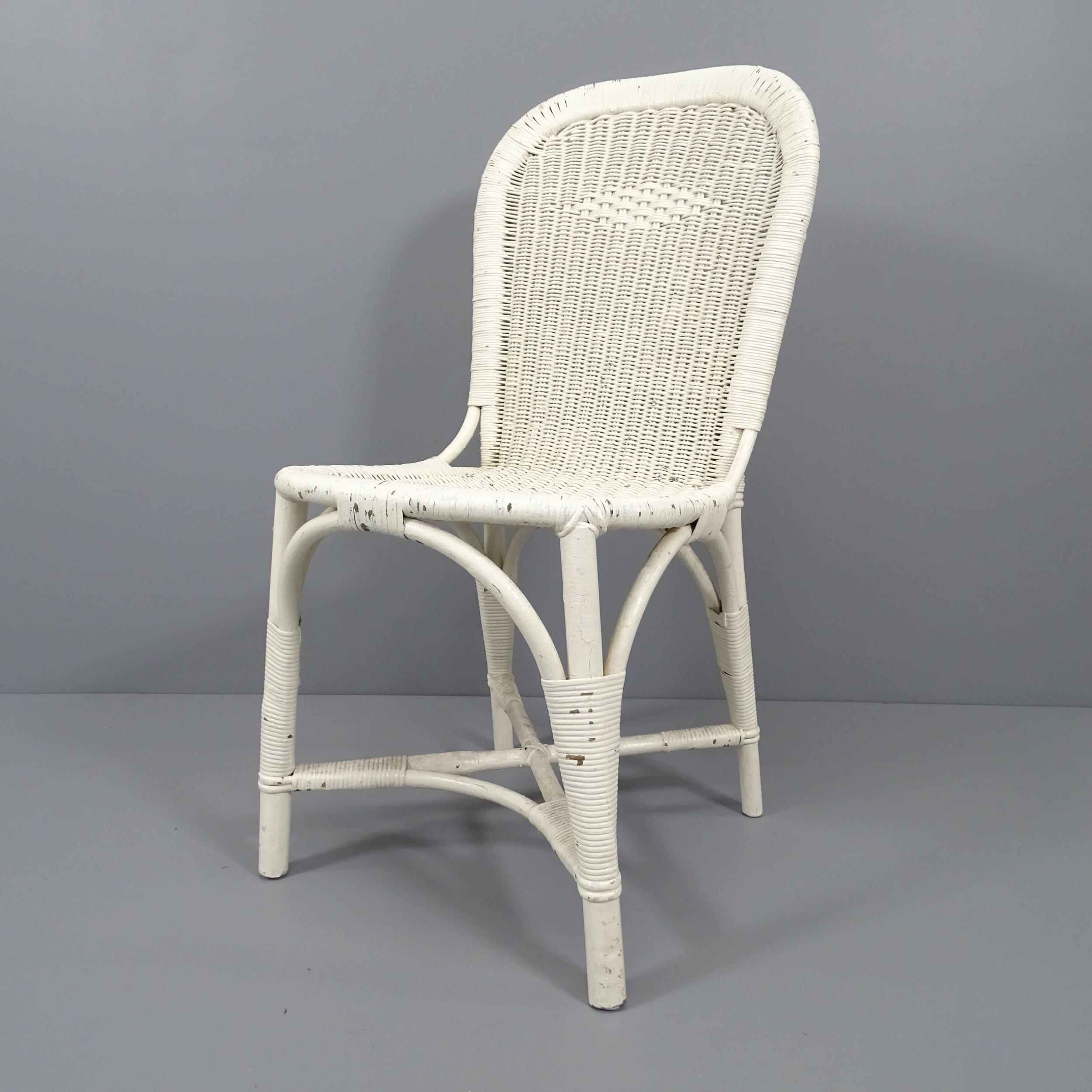 An early 20th century wicker chair by Dryad of Leicester with maker’s metal label