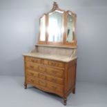 A French oak and marble-topped dressing chest, with raised mirror back, two short and three long