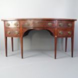 A George III mahogany bow-front side-board, with five fitted drawers and raised on square tapered