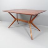 A mid-century teak "Helicopter" dining table, by E. Gomme for G-plan. 137x75x76cm In Good clean