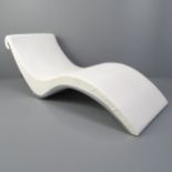 A Cattelan Italia Sylvester chaise longue in white eco leather with hidden wheels and maker's label.
