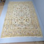 A cream-ground Kashan carpet. 295x200cm.