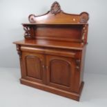 A reproduction mahogany chiffoniere, with raised back, two frieze drawers and cupboards under.