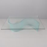 A modern glass top two-section coffee table, on S-shaped base. 119x37x79cm