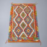 A Chobi Kilim rug. 132x85cm Good condition.