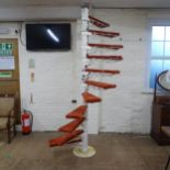 A cast iron spiral staircase, with eleven adjustable steps. Height 247, tread width 56cm, tread