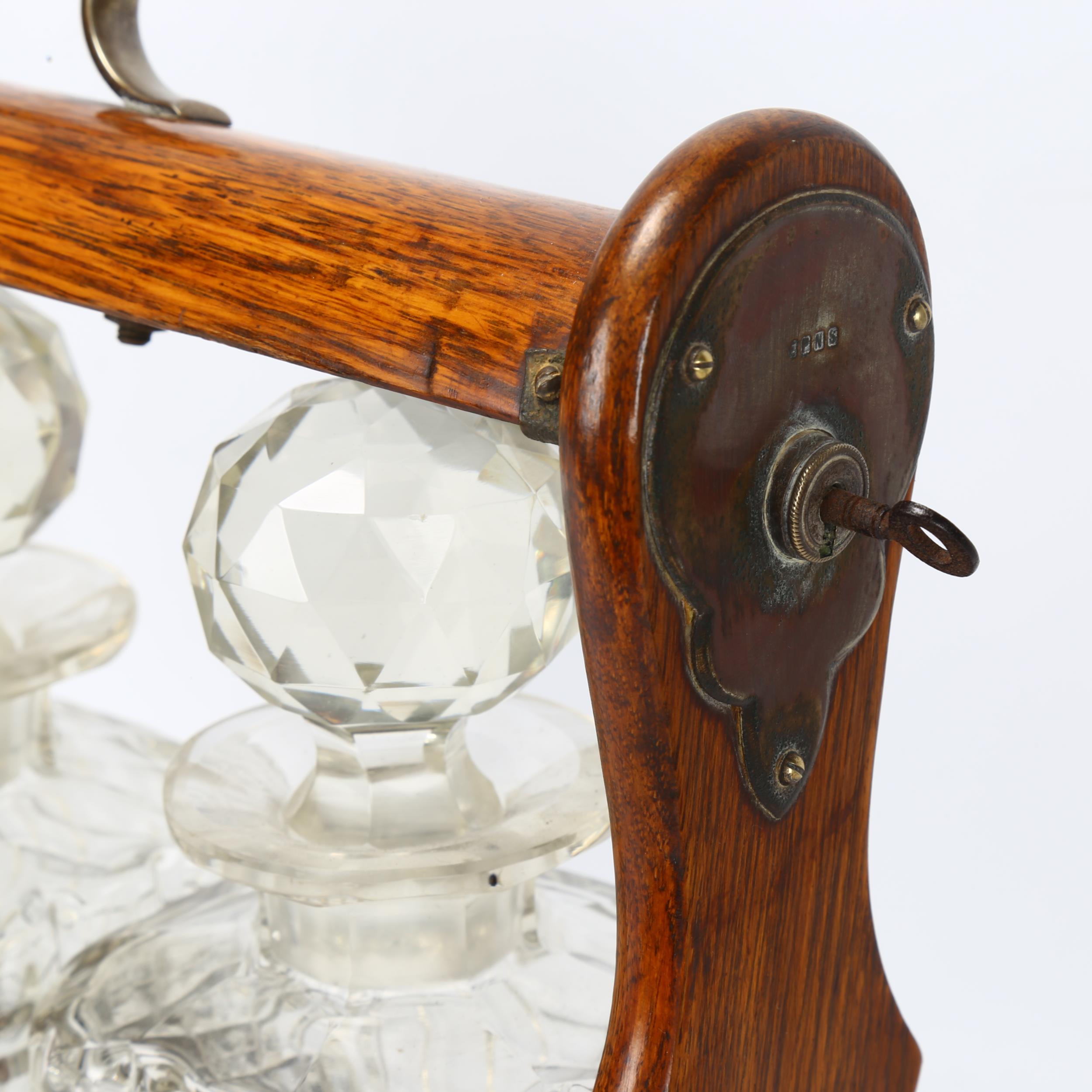 A late 19th/early 20th century 3-bottle oak tantalus, length 35.5cm Good condition, lock working, - Image 2 of 3