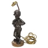 An Antique bronze cherub sculpture playing pipes, on marble base with lamp fitting, bronze height