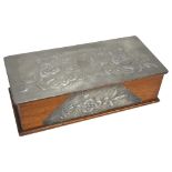 An Art Nouveau pewter-mounted oak box, with relief embossed floral decoration and removable