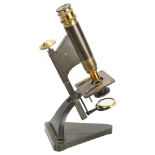 A 19th century desk microscope, by R & J Beck of London, with triangular base, serial no. 19393,