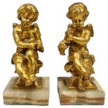 A pair of cast-brass cherub figures on green onyx bases, height 14cm No damage or restoration