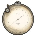 A Stanley of London brass aneroid barometer, late 19th century, with swivel magnifying glass, dial