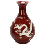 A large Chinese porcelain Sang de Boeuf 'Dragon' pear-shaped vase, Yuhuchunping, with applied dragon