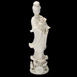 A Chinese blanc de chine Guanyin figure, height 25cm Head and 1 hand have been re-glued, finger tips