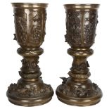 A pair of 19th century Chinese cast-bronze planters in 3 sections, with animals in high relief,
