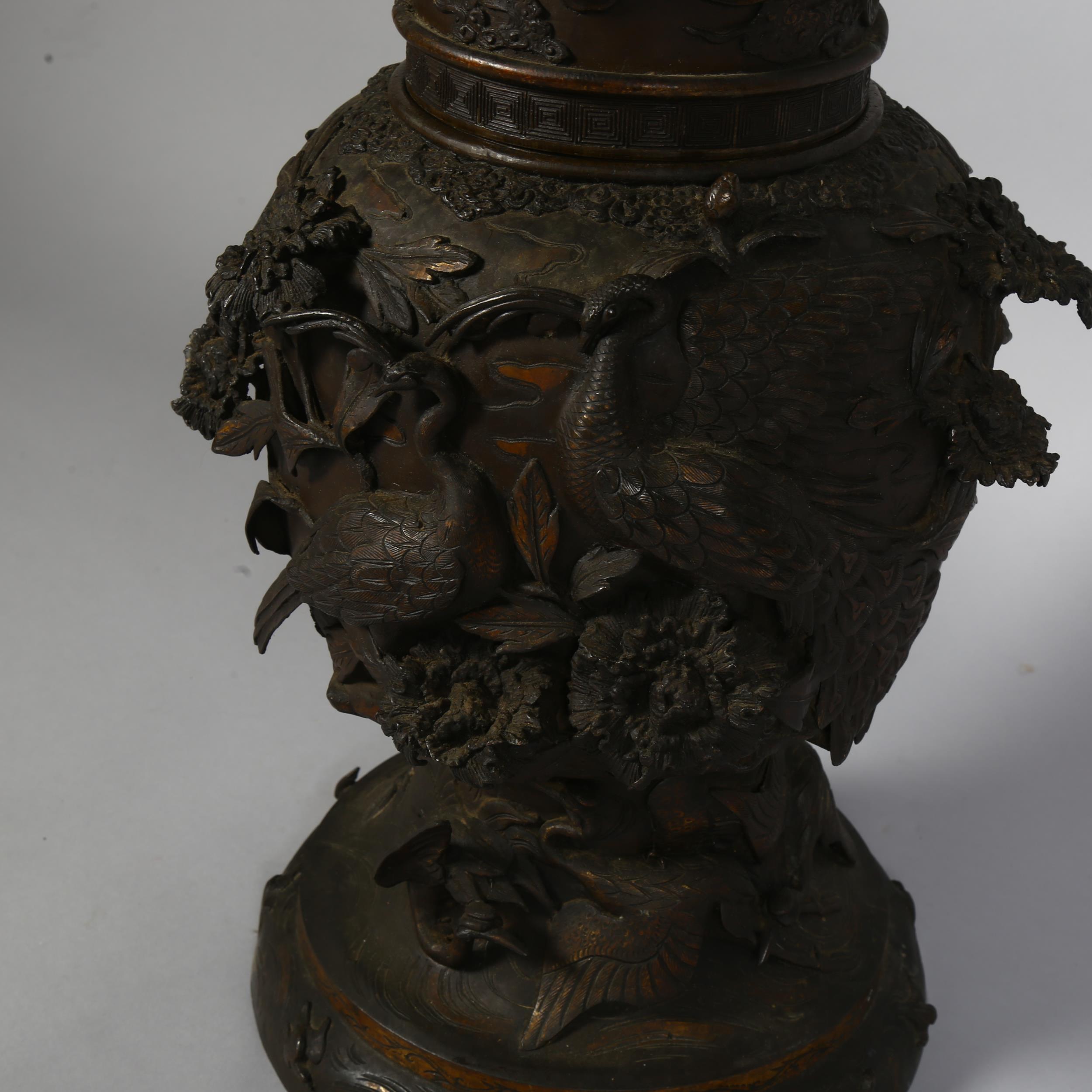 An Antique Chinese large cast-bronze vase in 2 sections, with birds and plants in high relief, - Image 3 of 3
