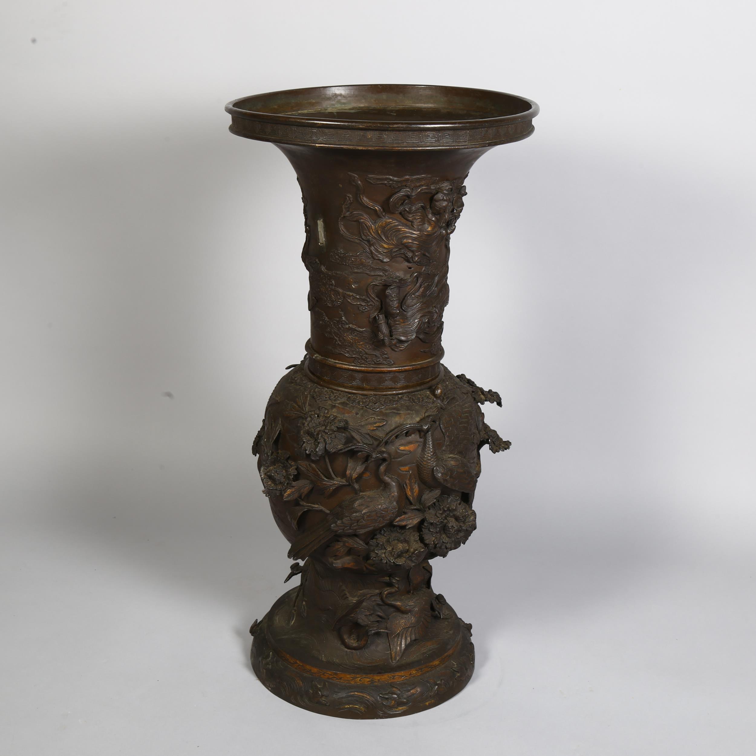 An Antique Chinese large cast-bronze vase in 2 sections, with birds and plants in high relief, - Image 2 of 3