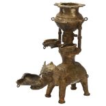 An early 19th century Basar tribal oil lamp depicting Lakshmi, Goddess of Light on a elephant