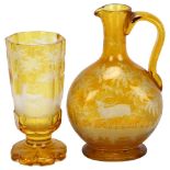 A Bohemian amber flashed glass stag drinking set, comprising moon flask ewer and goblet, goblet