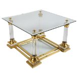 A 1950s' Maison Charles coffee table, with Lucite and gilt frame, mirrored edge glass top and shelf,