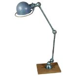 A 1950s' Jielde, French industrial bench mount lamp, with makers label, extended height 110cm