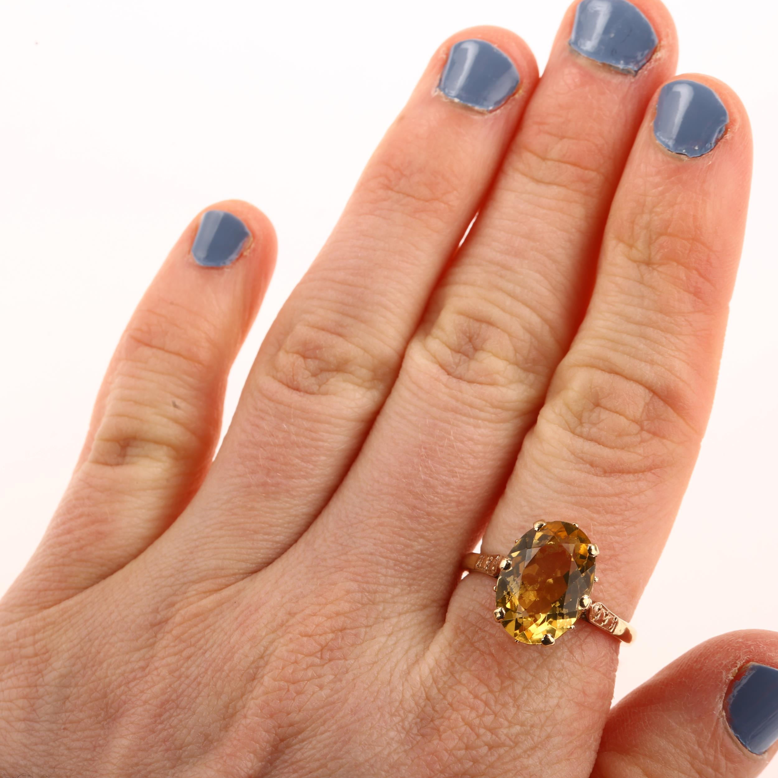 A late 20th century 9ct gold citrine dress ring, set with oval mixed-cut citrine, hallmarks - Image 4 of 4