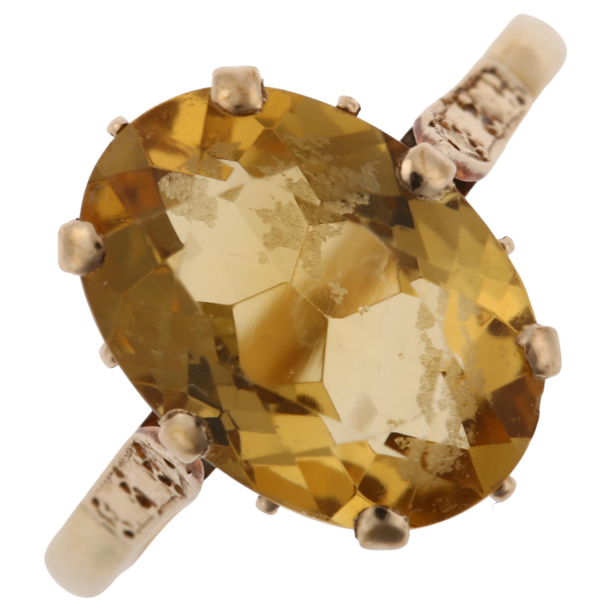 A late 20th century 9ct gold citrine dress ring, set with oval mixed-cut citrine, hallmarks