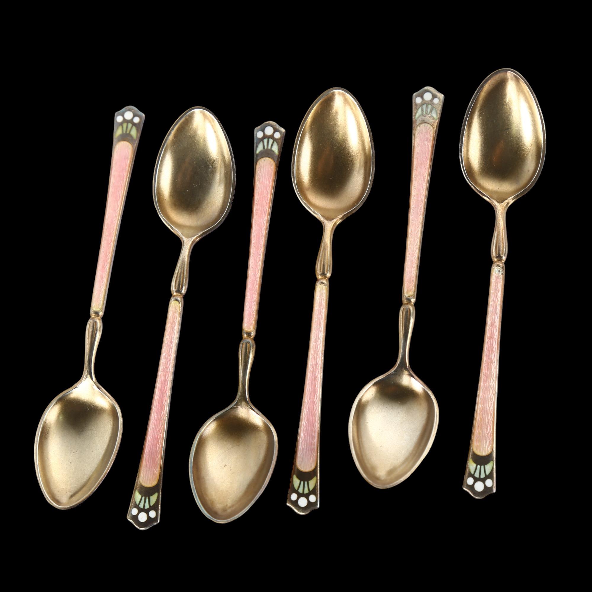 A set of 6 Continental sterling silver-gilt enamel coffee spoons, length 9.5cm No damage or