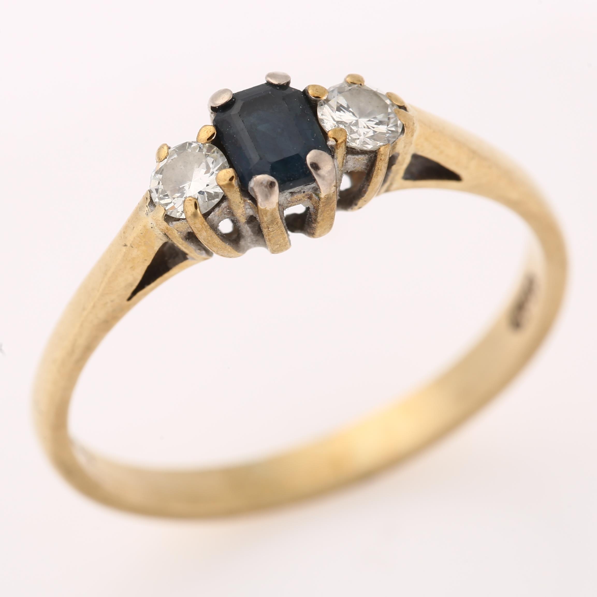 A modern 9ct gold three stone sapphire and diamond ring, set with emerald-cut sapphire and modern - Image 2 of 4