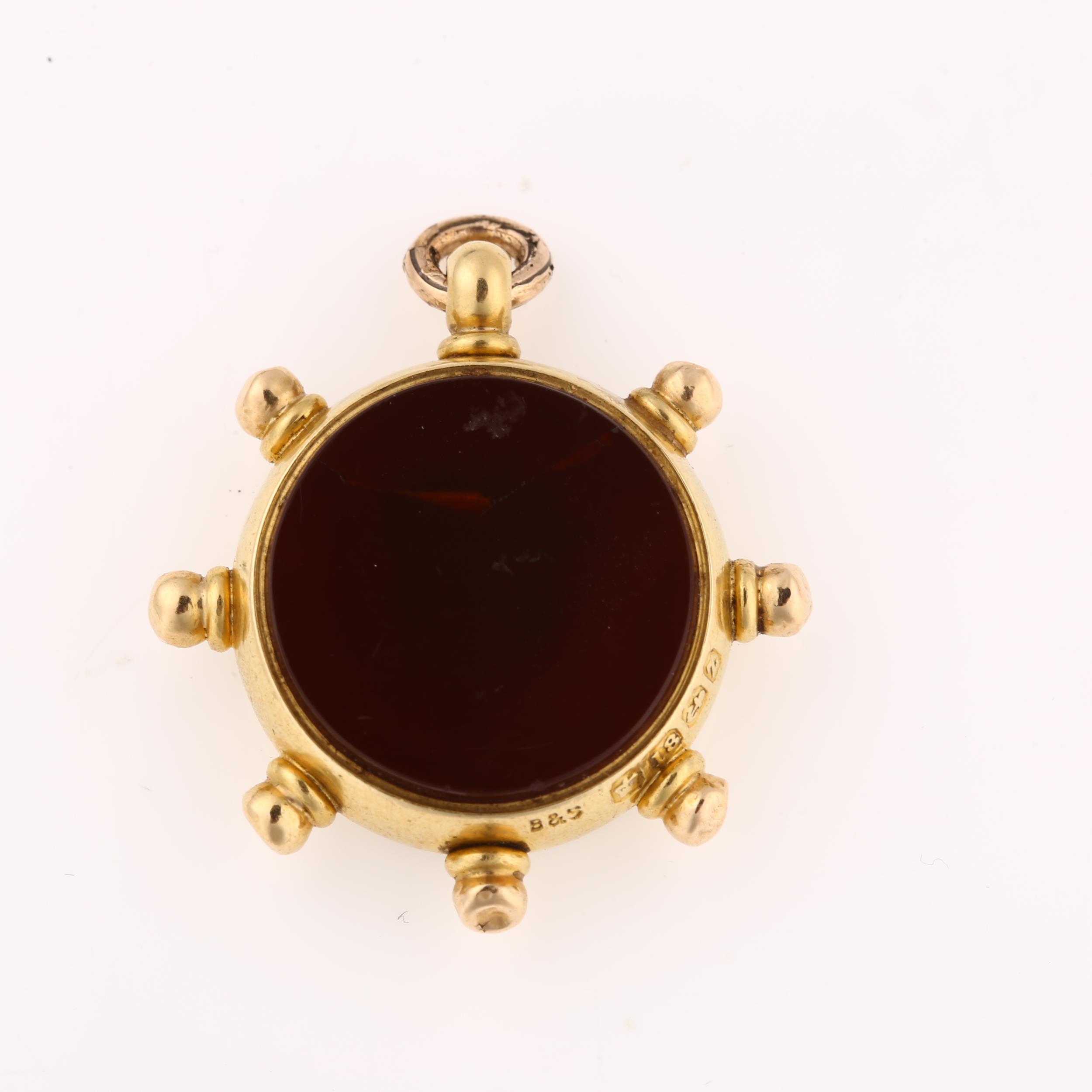 A late Victorian 18ct gold carnelian ship's wheel compass fob, maker's marks B and S, hallmarks - Image 3 of 4