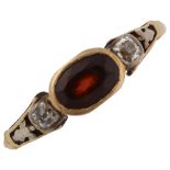 An Antique three stone garnet and diamond ring, unmarked gold settings with oval mixed-cut garnet