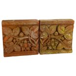 A pair of decorative terracotta bricks, with floral designs, 22.5cm